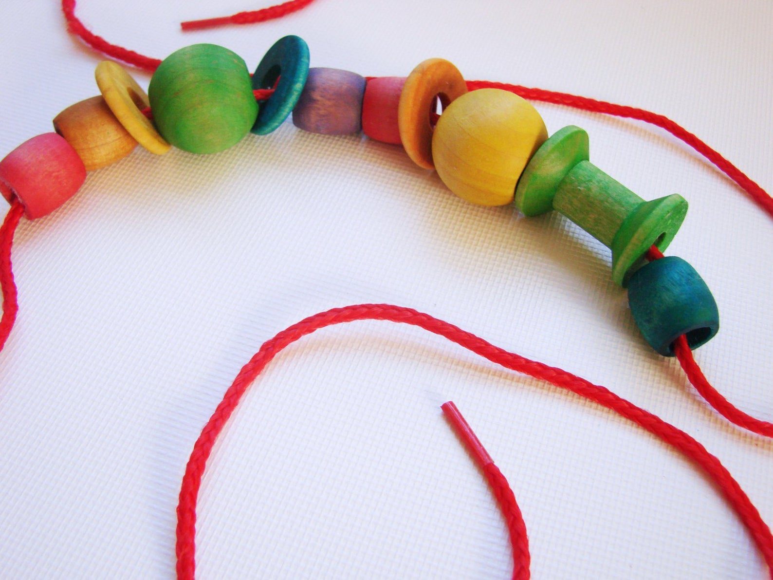 Lacing Beads - A Montessori and Waldorf Inspired Fine Motor Skill Game - Image 6